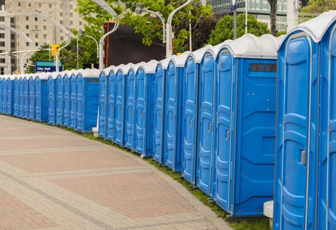 a row of sleek and modern portable restrooms at a special outdoor event in Acushnet, MA